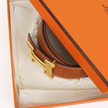 Hermès H Wendegürtel 85 aus Box- und Togo-Leder in Schwarz/Gold, 30 mm
