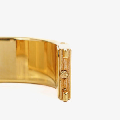 Hermès Loquet Armreif-Quarzuhr L01.100 mit grünem Equestrian Emaille und vergoldetem Finish
