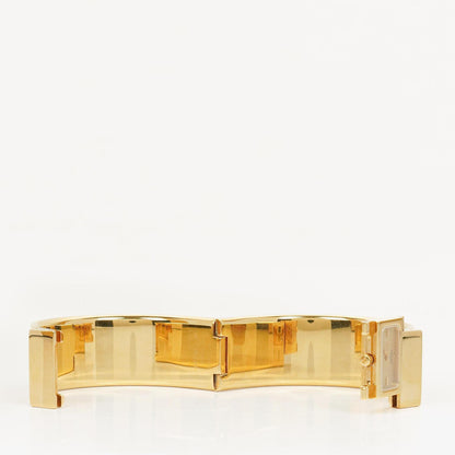 Hermès Loquet L01.201 Armreif-Quarzuhr mit grünem Reitsport-Emaille und Vergoldung