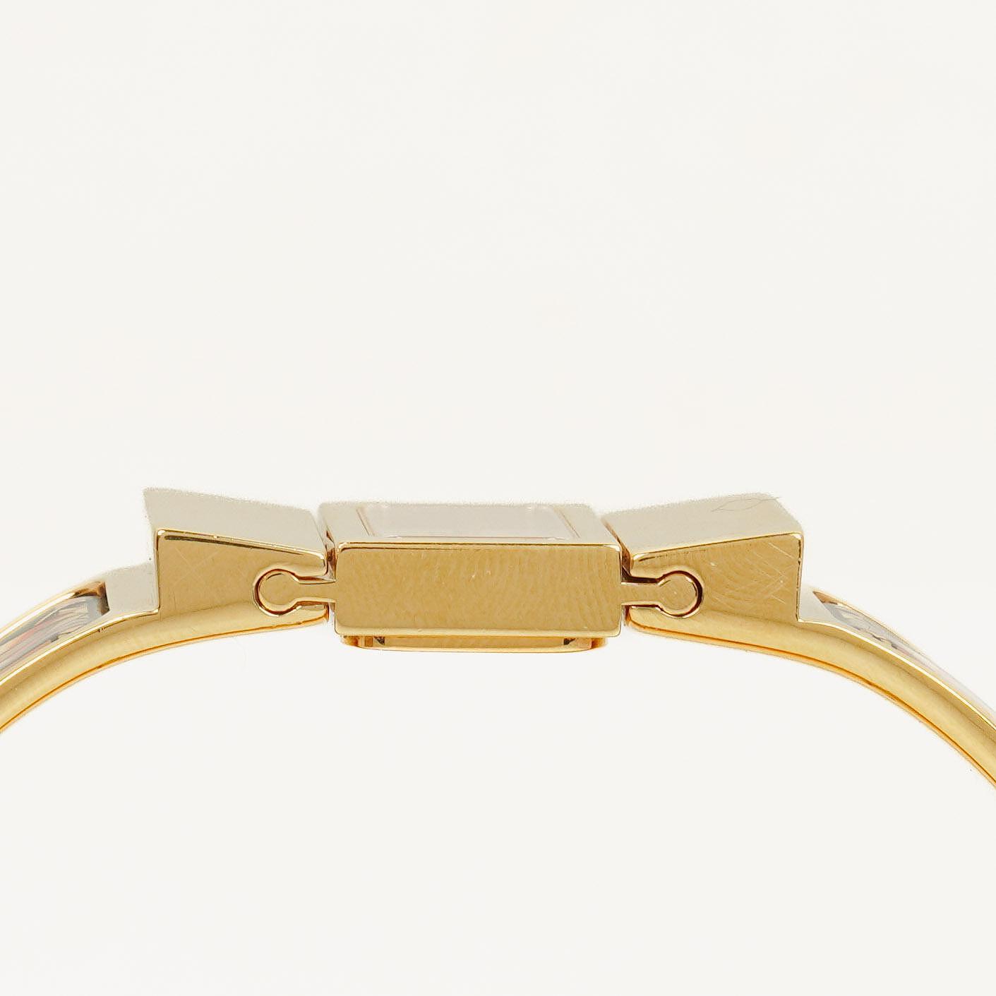 Hermès Loquet L01.201 Armreif-Quarzuhr mit grünem Reitsport-Emaille und Vergoldung