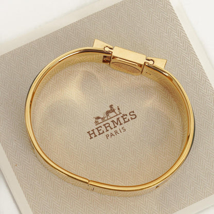 Hermès Loquet L01.201 Armreif-Quarzuhr mit grünem Reitsport-Emaille und Vergoldung