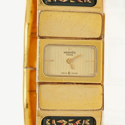 Hermès Loquet Armreif-Quarzuhr L01.201 mit grünem Reitsport-Emaille und Vergoldung