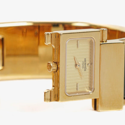 Hermès Loquet L01.201 Armreif-Quarzuhr mit grünem Reitsport-Emaille und Vergoldung