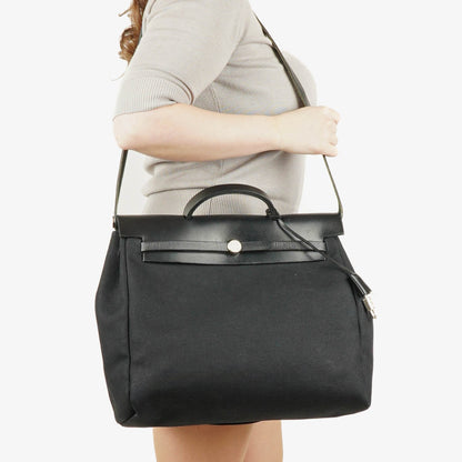 Hermès Herbag MM 2-in-1 Tasche aus Toile Vache Hunter in Schwarz