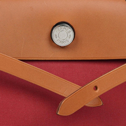 Hermès Herbag Zip 31 PM aus Fauve Vache Hunter und Rubis Toile mit Palladium-Beschlägen