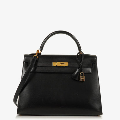 Hermès Kelly 32 Sellier Vintage aus schwarzem Boxkalbsleder mit Goldbeschlägen, 2003