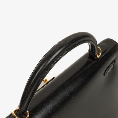 Hermès Kelly 32 Sellier Vintage aus schwarzem Boxkalbsleder mit Goldbeschlägen, 2003