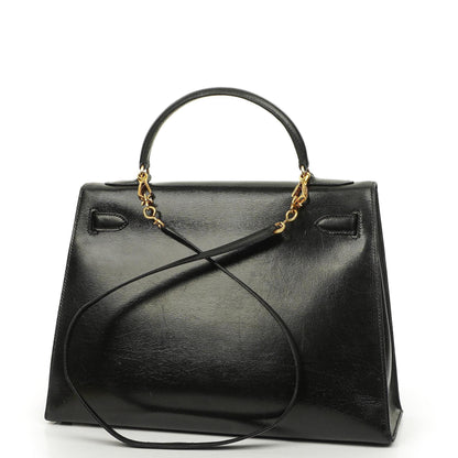Hermès Kelly 32 Vintage Sellier aus schwarzem Boxcalf mit goldfarbener Hardware, 1987