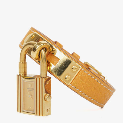 Hermès Kelly Uhr mit beigem Leder und Vergoldung