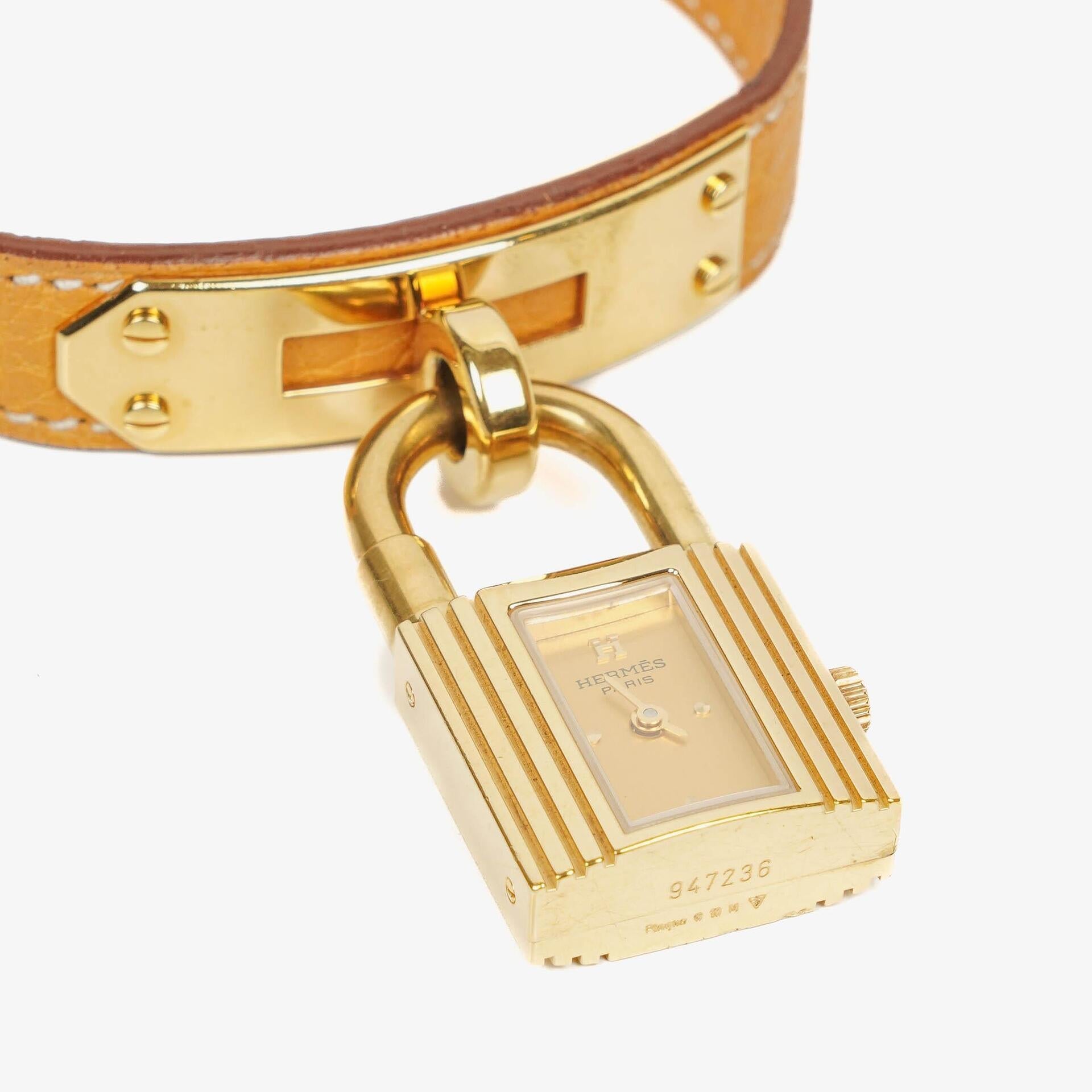Hermès Kelly Uhr mit beigem Leder und Vergoldung