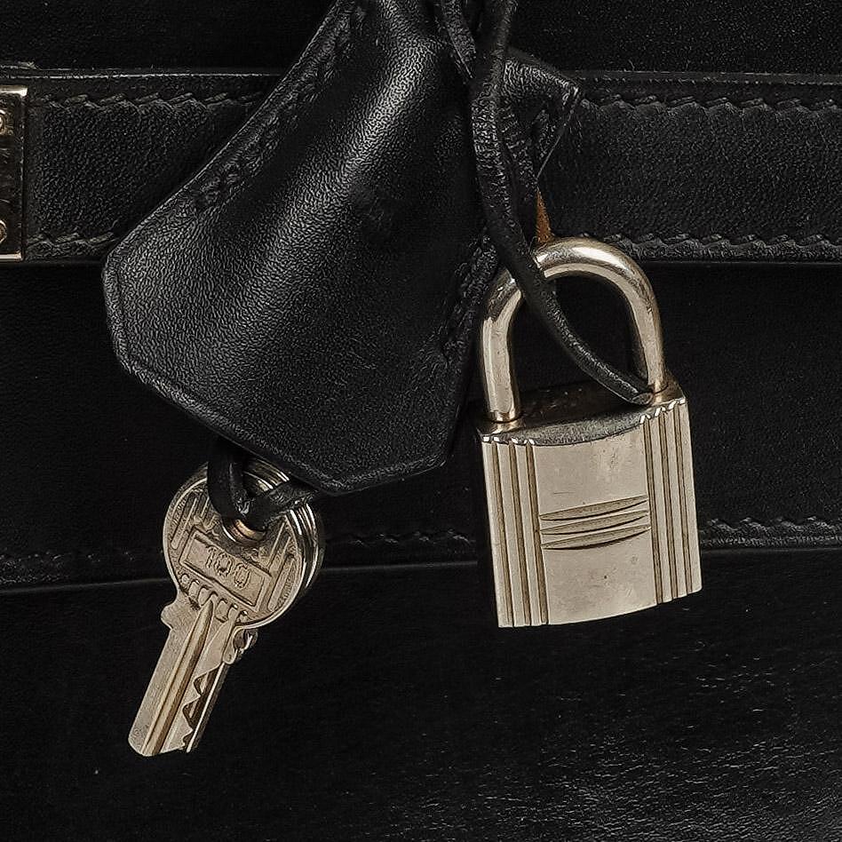 Hermès Kelly Depeches 37 aus schwarzem Boxleder mit Palladium-Beschlägen, 2003