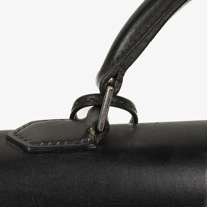 Hermès Kelly Depeches 37 aus schwarzem Boxleder mit Palladium-Beschlägen, 2003
