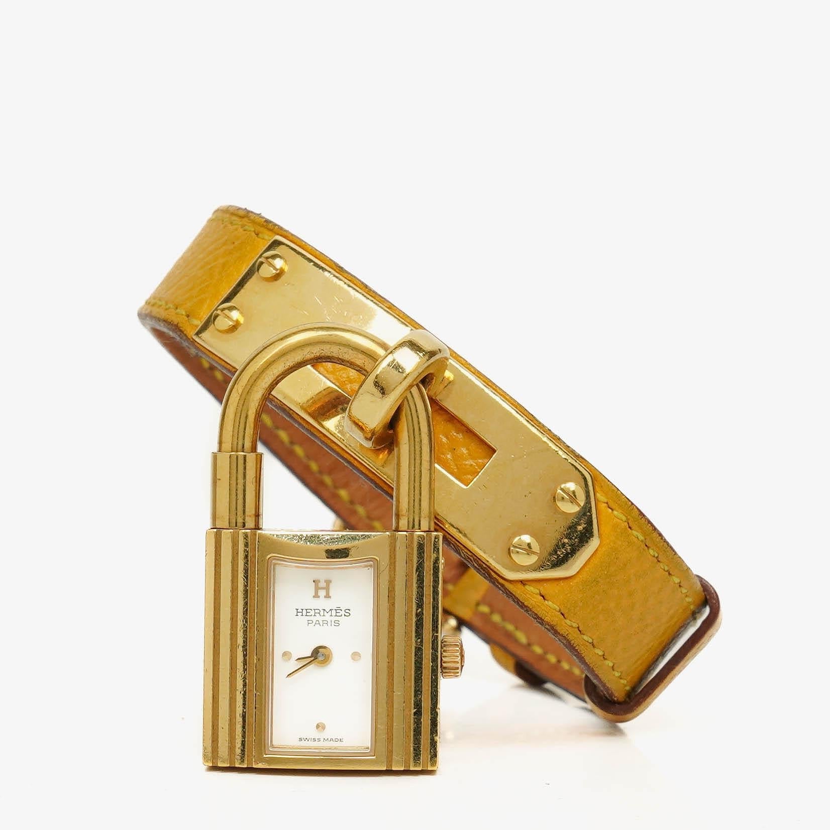 Hermès Kelly vergoldete Uhr mit Leder