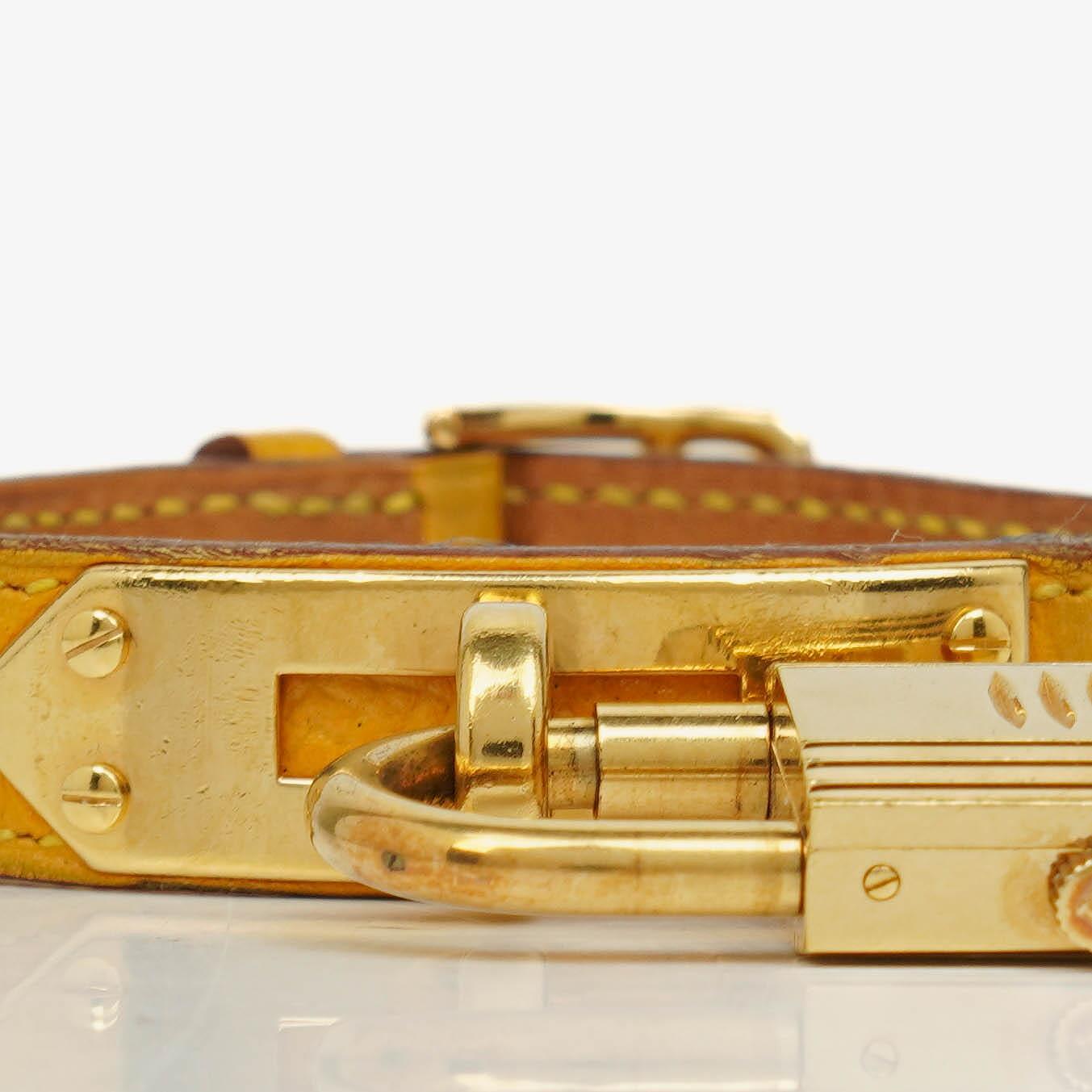 Hermès Kelly vergoldete Uhr mit Leder