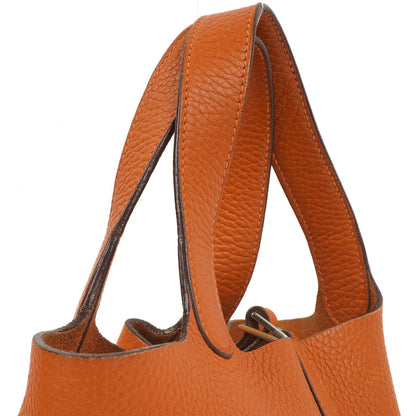 Hermès Picotin 18 PM Bucket Tasche aus orangefarbenem Taurillon Clemence