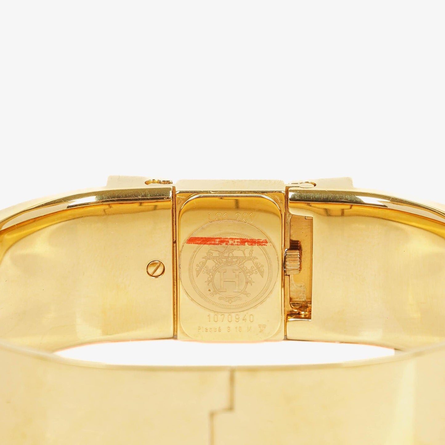 Hermès Loquet Armreif-Quarzuhr L01.200 mit rotem Reiter-Emaille und vergoldeten Details