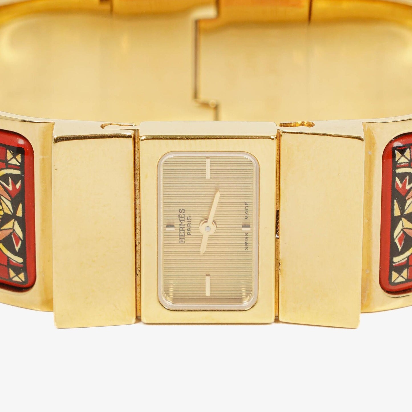 Hermès Loquet Armreif-Quarzuhr L01.200 mit rotem Reiter-Emaille und vergoldeten Details