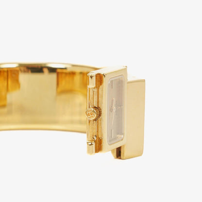 Hermès Loquet Armreif-Quarzuhr L01.200 mit rotem Reiter-Emaille und vergoldeten Details