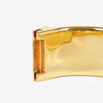 Hermès Loquet Armreif-Quarzuhr L01.200 mit rotem Reiter-Emaille und vergoldeten Details