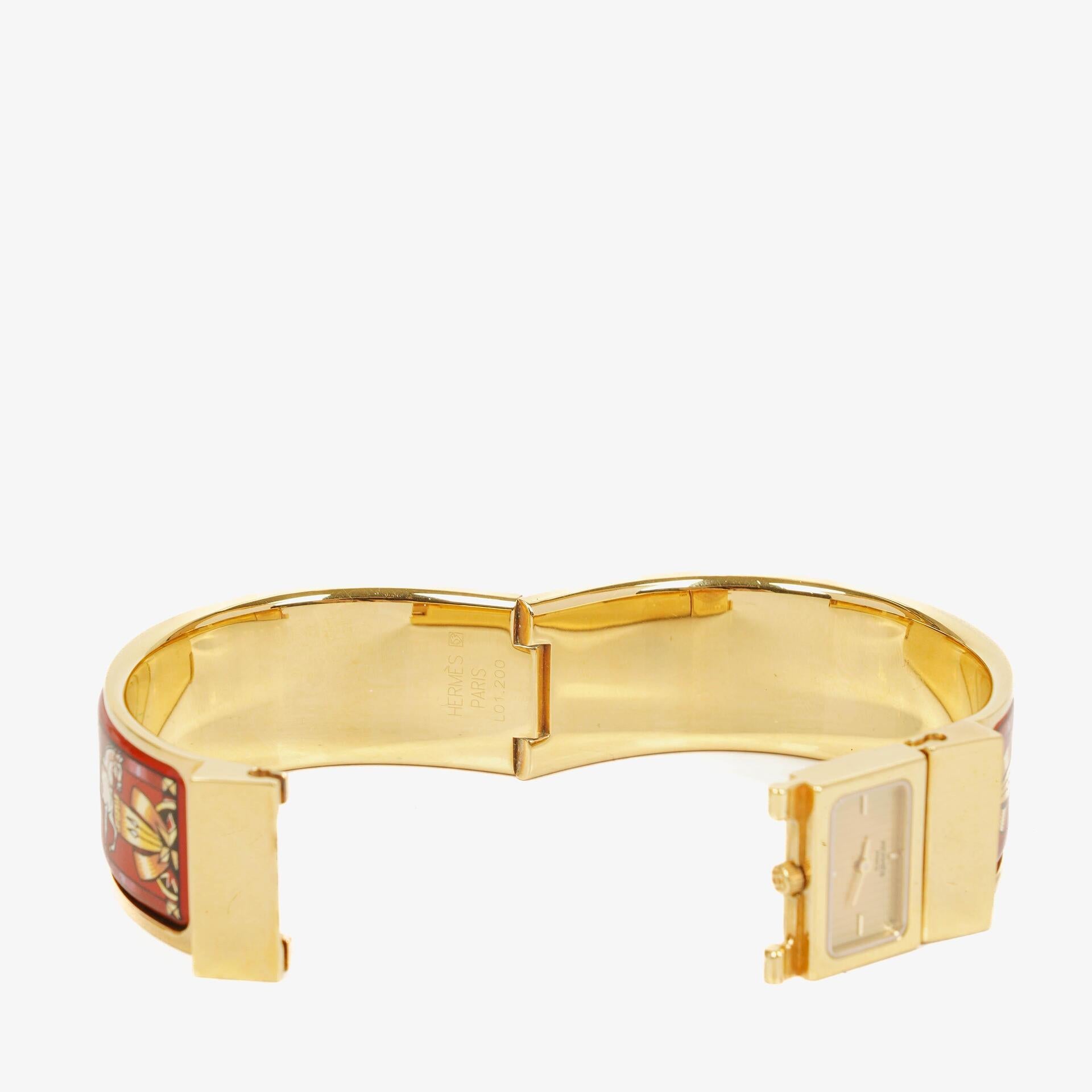 Hermès Loquet Armreif-Quarzuhr L01.200 mit rotem Reiter-Emaille und vergoldeten Details