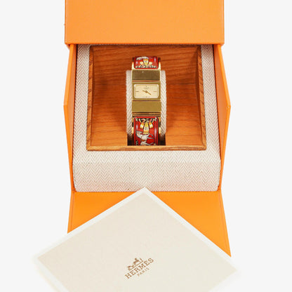 Hermès Loquet Armreif-Quarzuhr L01.200 mit rotem Reiter-Emaille und vergoldeten Details