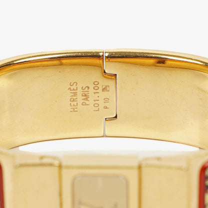 Hermès Loquet Armreif-Quarzuhr mit roter Reitsport-Emaille und vergoldetem Finish, L01.201