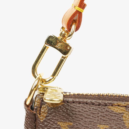 Louis Vuitton Pochette Accessoires Clutch aus Monogram Canvas