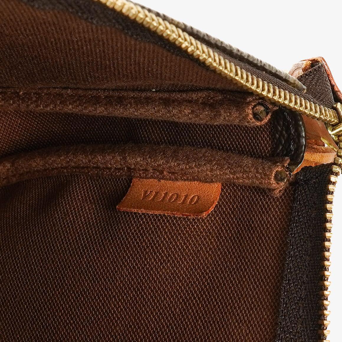 Louis Vuitton Pochette Accessoires Clutch aus Monogram Canvas