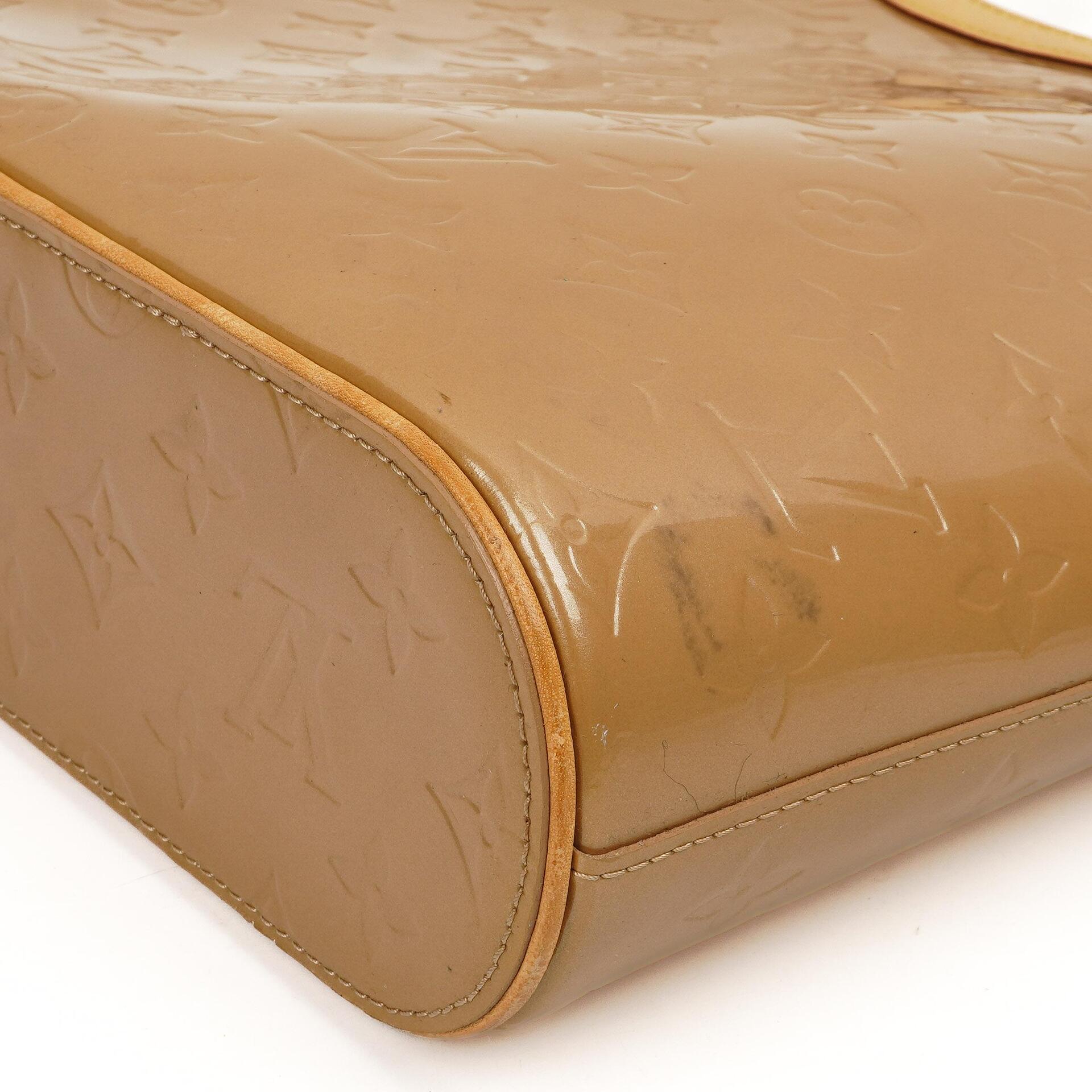 Louis Vuitton Stillwood Vertikale Beigefarbene Monogram Vernis Handtasche
