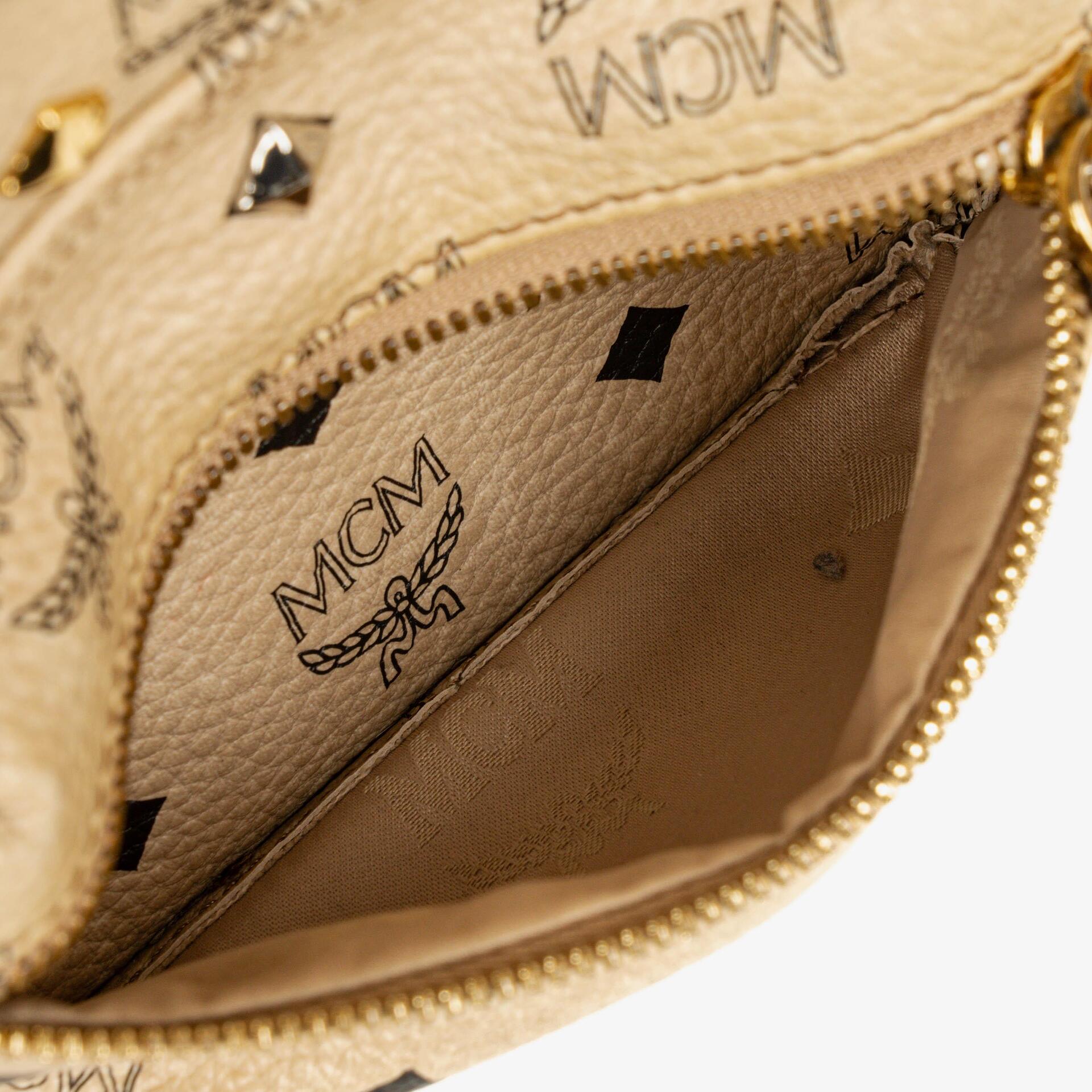 MCM Visetos Rucksack aus neutralem beschichtetem Canvas mit Nieten